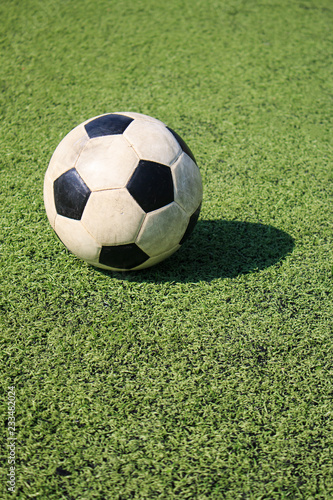 Football on artificial turf. It is for green background in a stadium