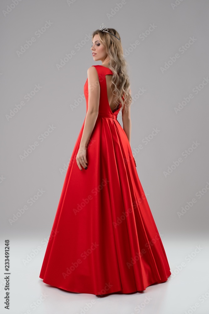 Pretty blonde in luxurious red evening dress shot Pretty blonde in luxurious red evening dress shot