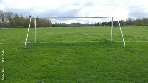 Athletic fields viewed through soccer goalposts. Sunnybrook Park, Toronto. Handheld shot with stabilized camera. photo