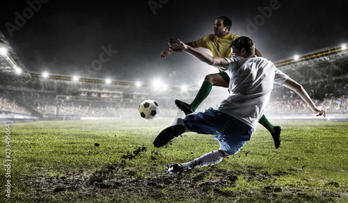 Fototapeta Naklejka Na Ścianę i Meble -  Soccer players at stadium. Mixed media
