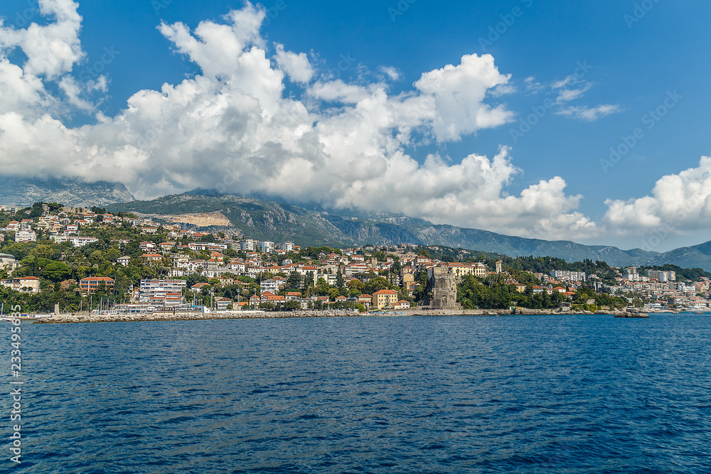 Coast of the Adriatic Sea in Montenegro, blue sky with clouds