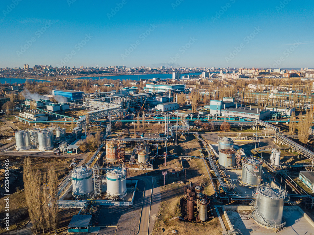 Chemical factory industrial area. Aerial view. Large vats connected by pipeline 
