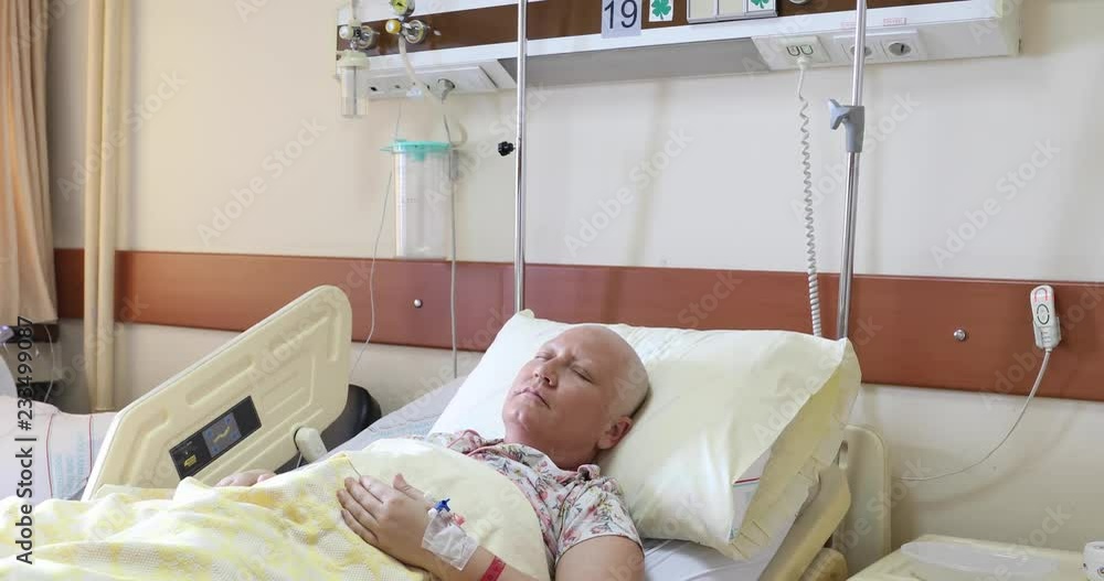 Cancer patient lying in hospital bed Cancer patient lying in hospital bed