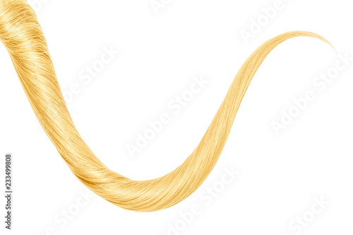 Thin curl of blond hair isolated on white background. Top-down view