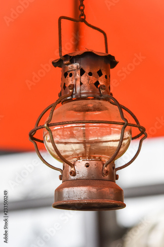 Old lantern hang the roof with orange background - lamp Vintage © Bigc Studio