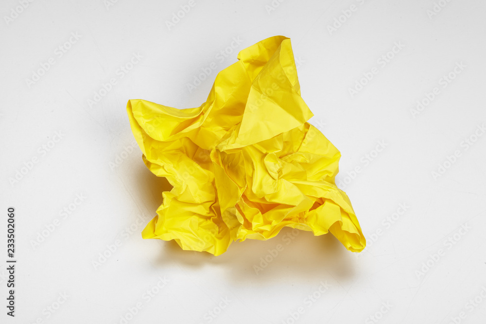 close up of a crumpled paper with curled edge on white background close up of a crumpled paper with curled edge on white background