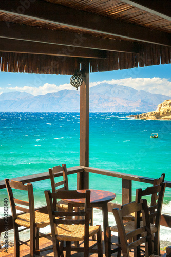 Table on the terrace of the restaurant at The Matala beach on the island of Crete, Greece