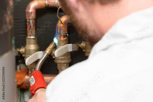 Plumber Using Torch