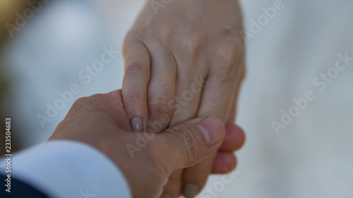 Men's hand held women.