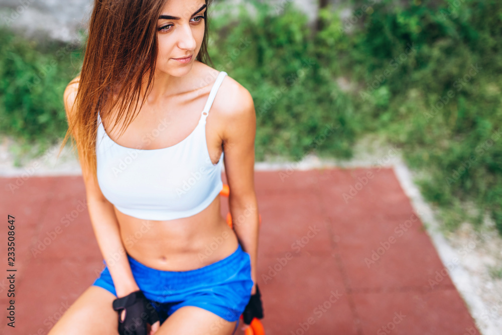 Pretty young sporty girl workout outdoor on the street. Pretty young sporty girl workout outdoor on the street.