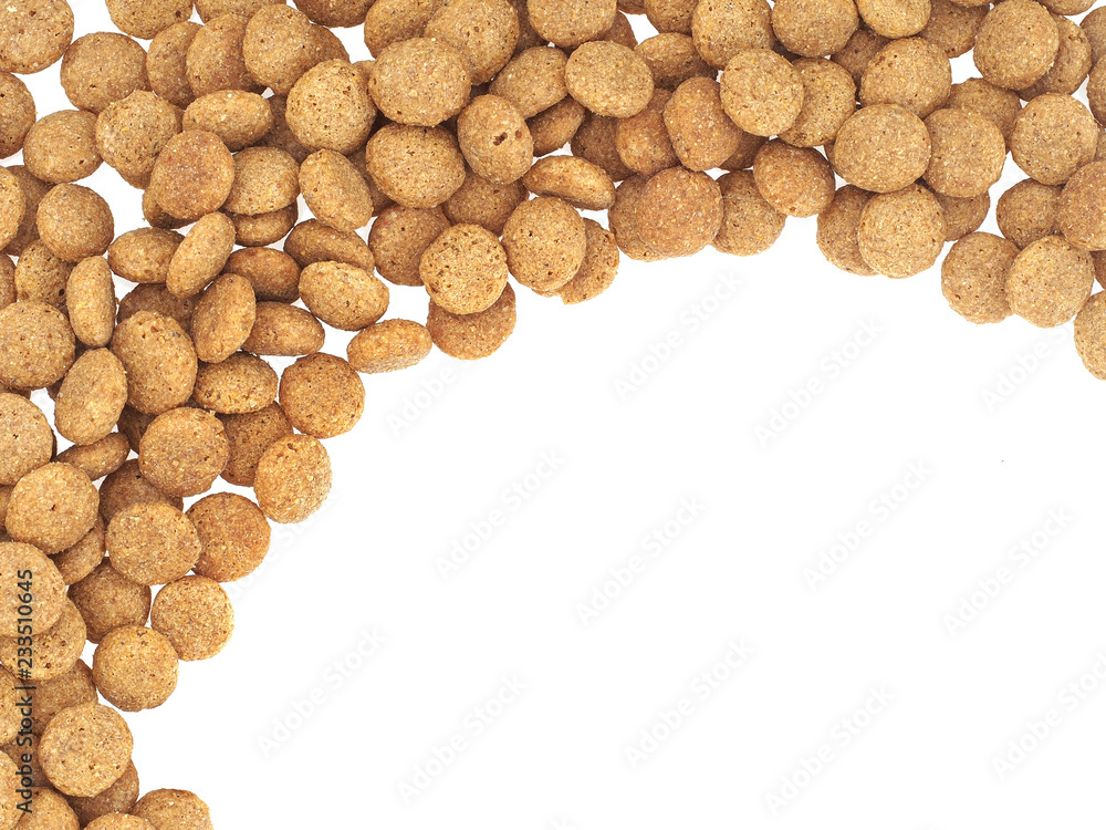 Dried dog food background on white. Border, edge. Dried dog food background on white. Border, edge.