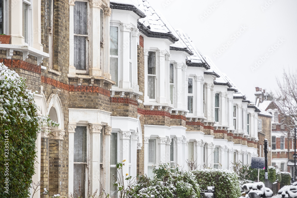 British terraced houses in winter snow around West Hampstead in London