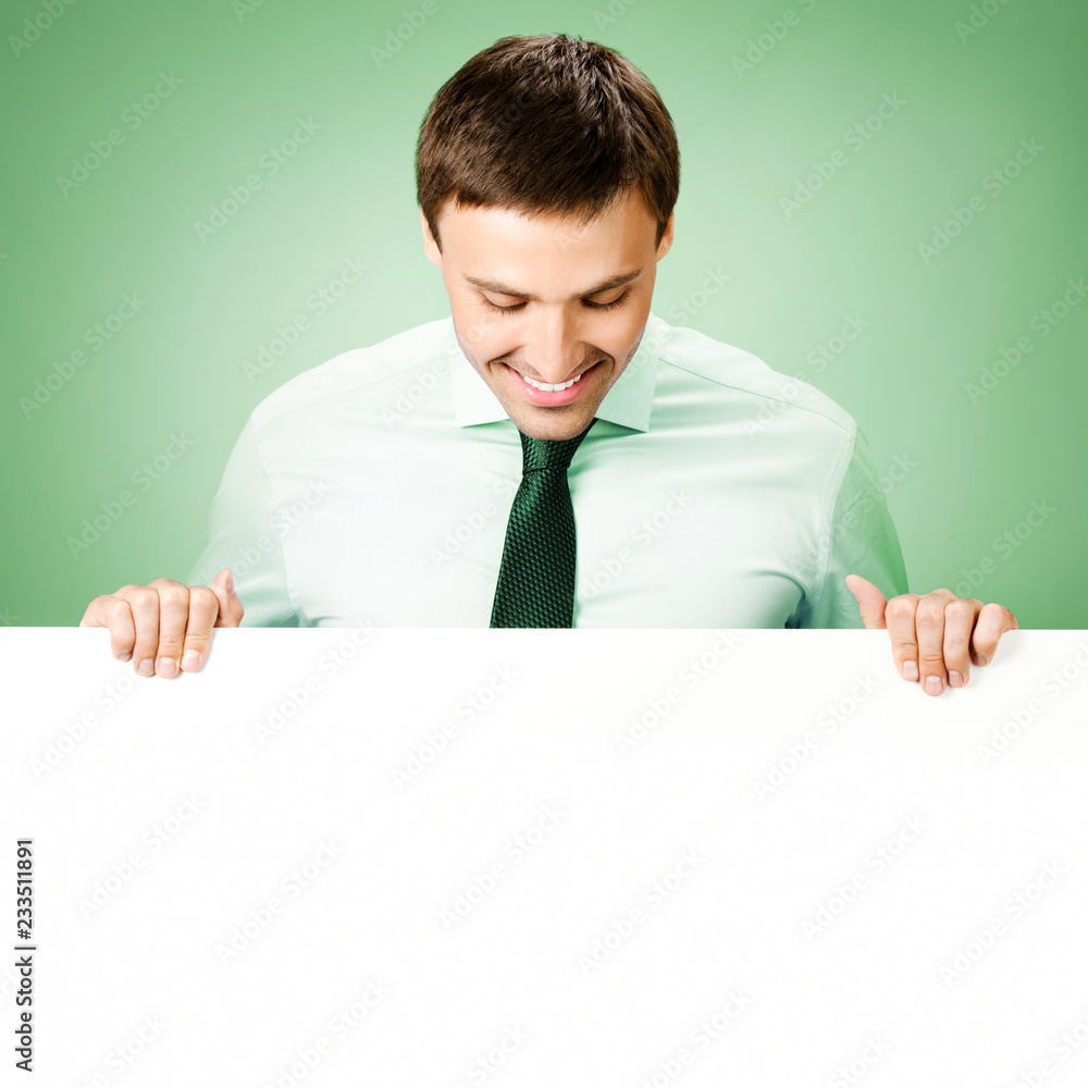 Businessman showing blank signboard Businessman showing blank signboard