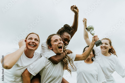 Fototapeta Naklejka Na Ścianę i Meble -  Female football players celebrating their victory