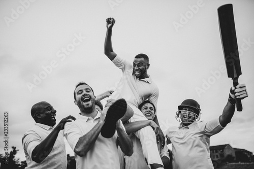 Fototapeta Naklejka Na Ścianę i Meble -  Cheerful cricketers celebrating their victory