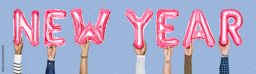© Rawpixel.com - Hands holding New Year word in balloon letters