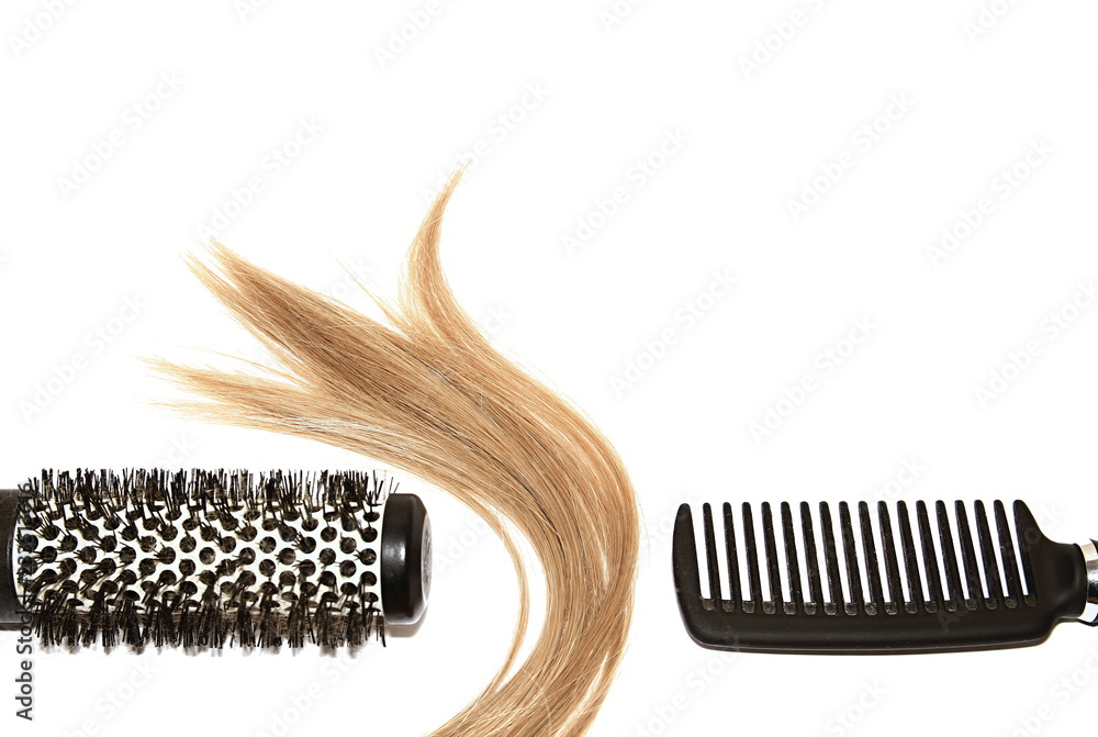 Obraz premium Woman hair styling with hair brushes