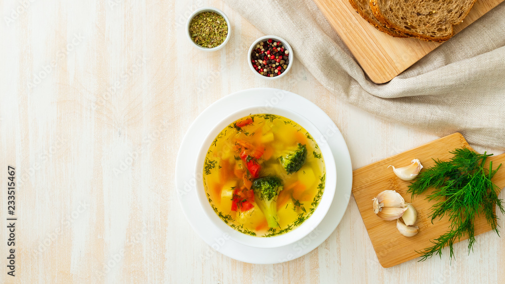 Healthy bright spring vegetable dietary vegetarian soup with broccoli, top view, long banner format, copy space Healthy bright spring vegetable dietary vegetarian soup with broccoli, top view, long banner format, copy space