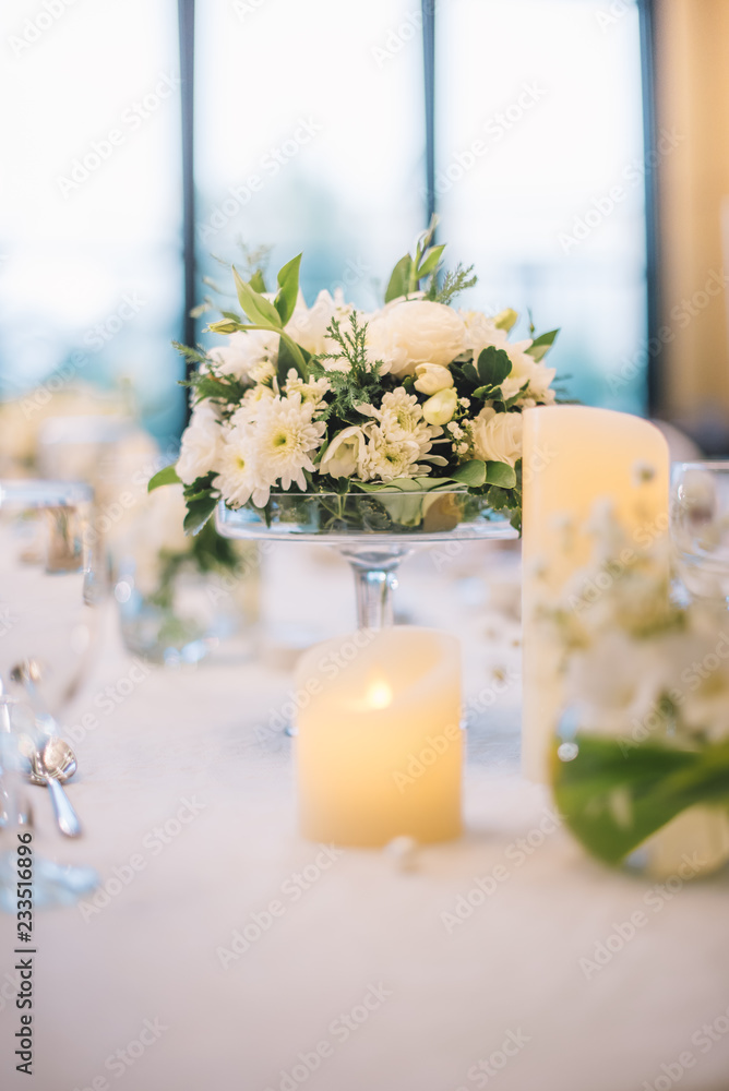 Table setting at a luxury wedding reception.