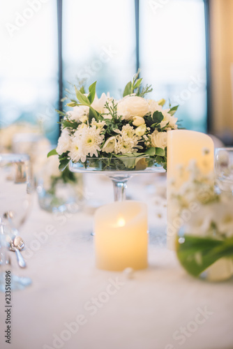 Table setting at a luxury wedding reception.