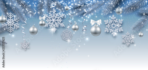 Christmas and New Year shiny banner with silver Christmas balls and snowflakes.