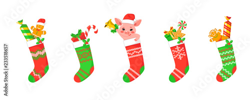 Set of cute vector illustration of Christmas stocking with gifts, little pig, gingerbread and sweets. Vector illustration isolated on white background