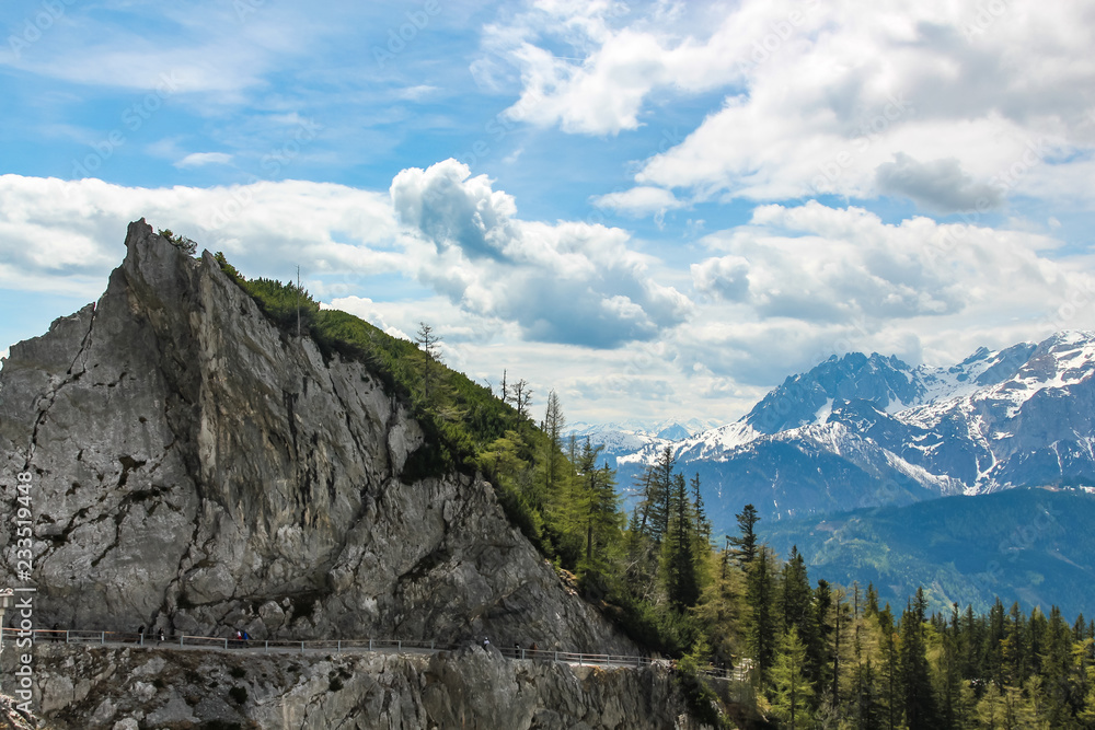 View of a zigzaging mountain road leading to the eisriesenwelt ice cave Eisriesenwelt in Austria. View of a zigzaging mountain road leading to the eisriesenwelt ice cave Eisriesenwelt in Austria.