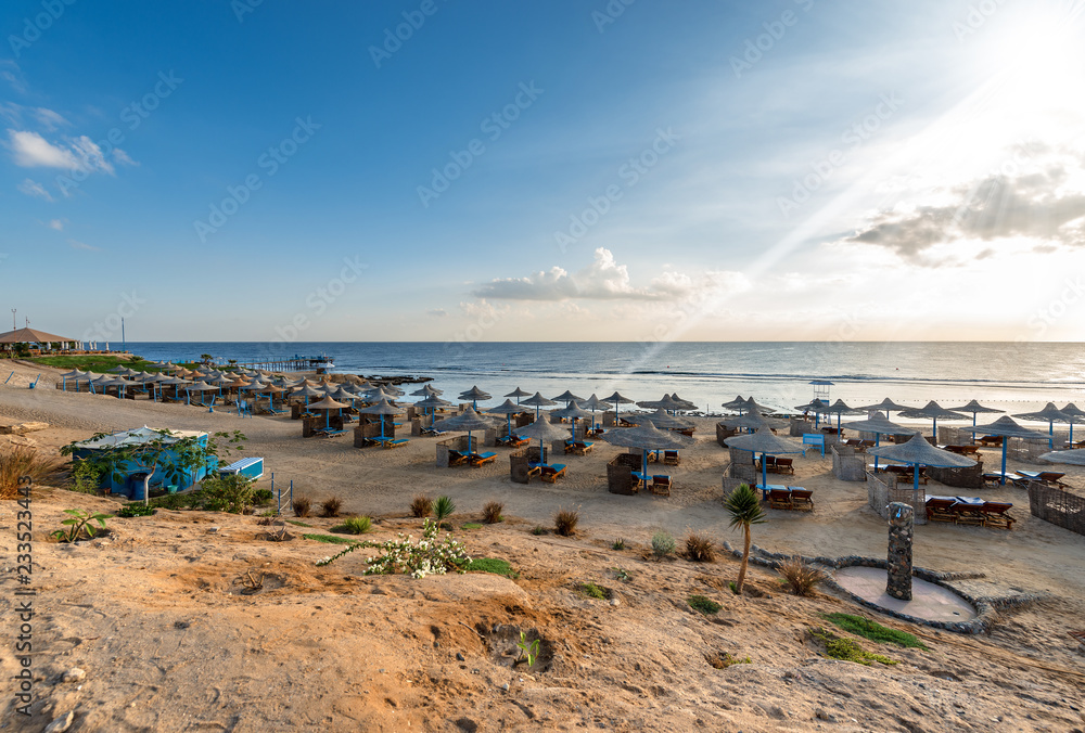 Red Sea Egypt - Beach with Umbrellas and Deck Chairs Red Sea Egypt - Beach with Umbrellas and Deck Chairs