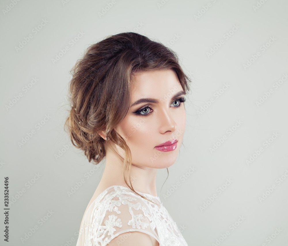 Young beautiful woman face closeup portrait. Perfect makeup, bridal hair Young beautiful woman face closeup portrait. Perfect makeup, bridal hair