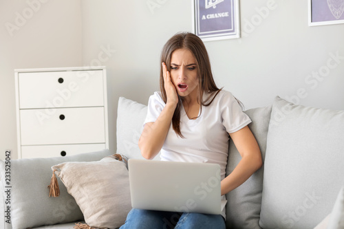 Emotional young woman after...