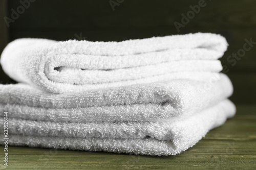 Soft towels on wooden table