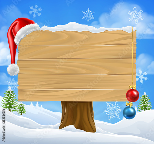 A Christmas sign with a San...