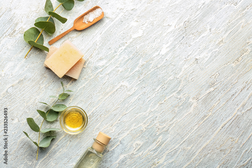 Eucalyptus essential oil, sea salt and soap on white background