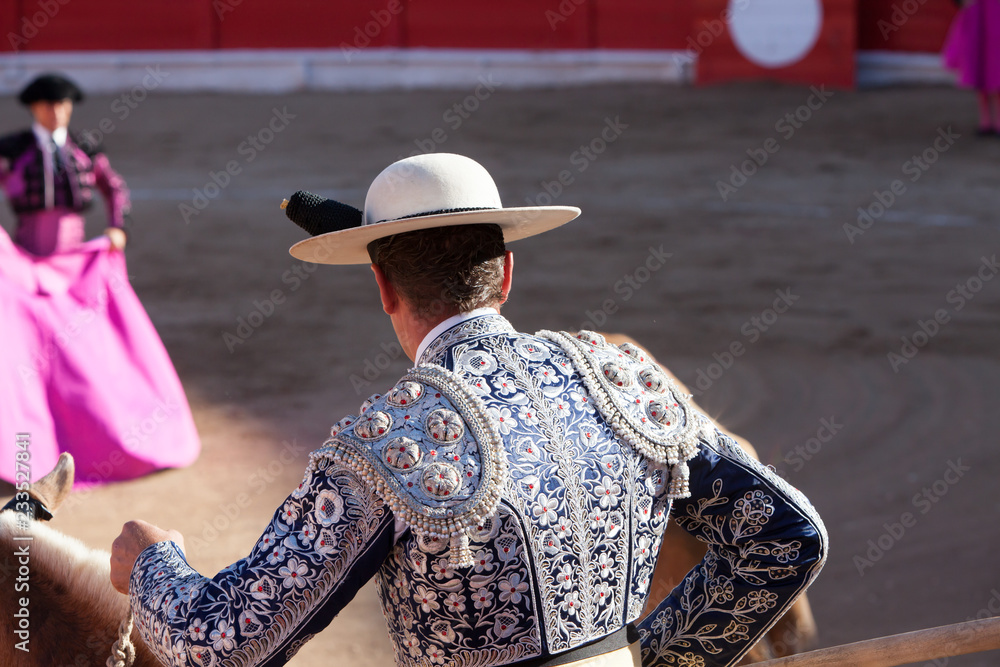 Bullfight, Spanish deadly Spectacle where a man (torero) risks his life fighting again an angry Bull with dangerous horns. This tradition is still strong and alive in Spain. 