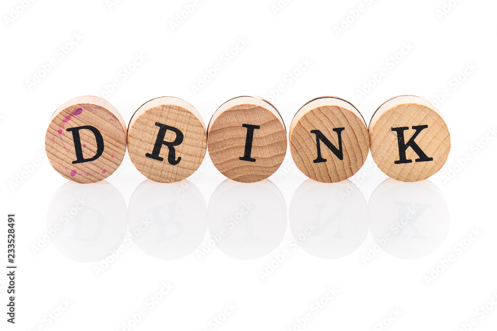 Word Drink from circular wooden tiles with letters children toy. Word Drink from circular wooden tiles with letters children toy.