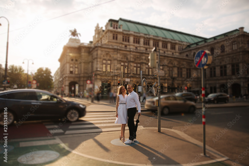 Lovely couple walking around the city. During the summer. Evening time sunset in city