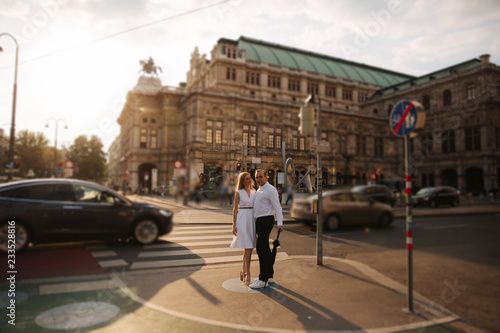 Wallpaper Mural Lovely couple walking around the city. During the summer. Evening time sunset in city Torontodigital.ca