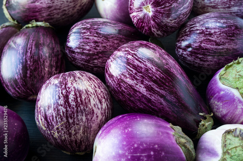Background of fresh eggplant. Aubergine vegetable. Purple eggplant (aubergine). Top view. Purple food.