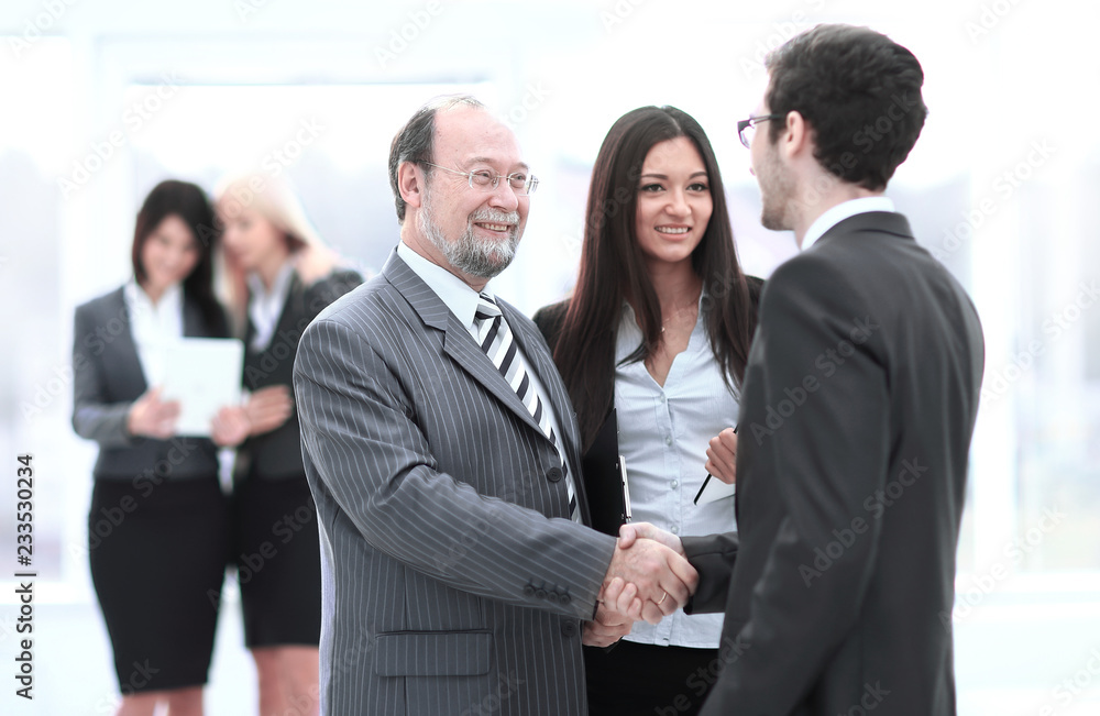 welcome and handshake of business people in the office. welcome and handshake of business people in the office.