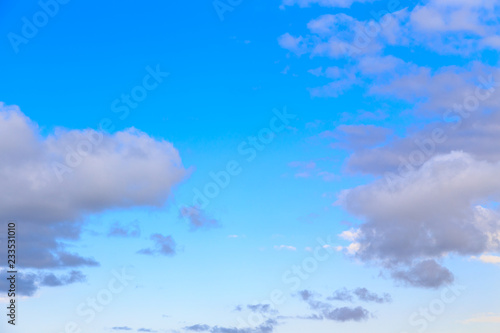 Blue sky with white cumulus clouds. Abstract natural background. Perfect summer day in the countryside. © Alwih