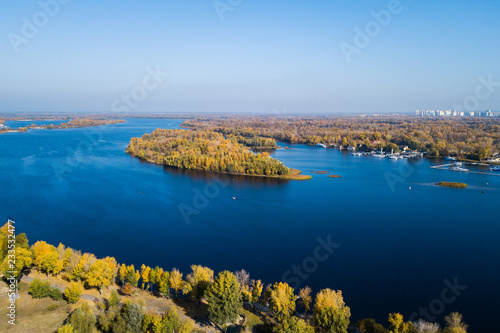 Aerial: Autumn landscape of Dnipro river in Kyiv, Ukraine © castenoid