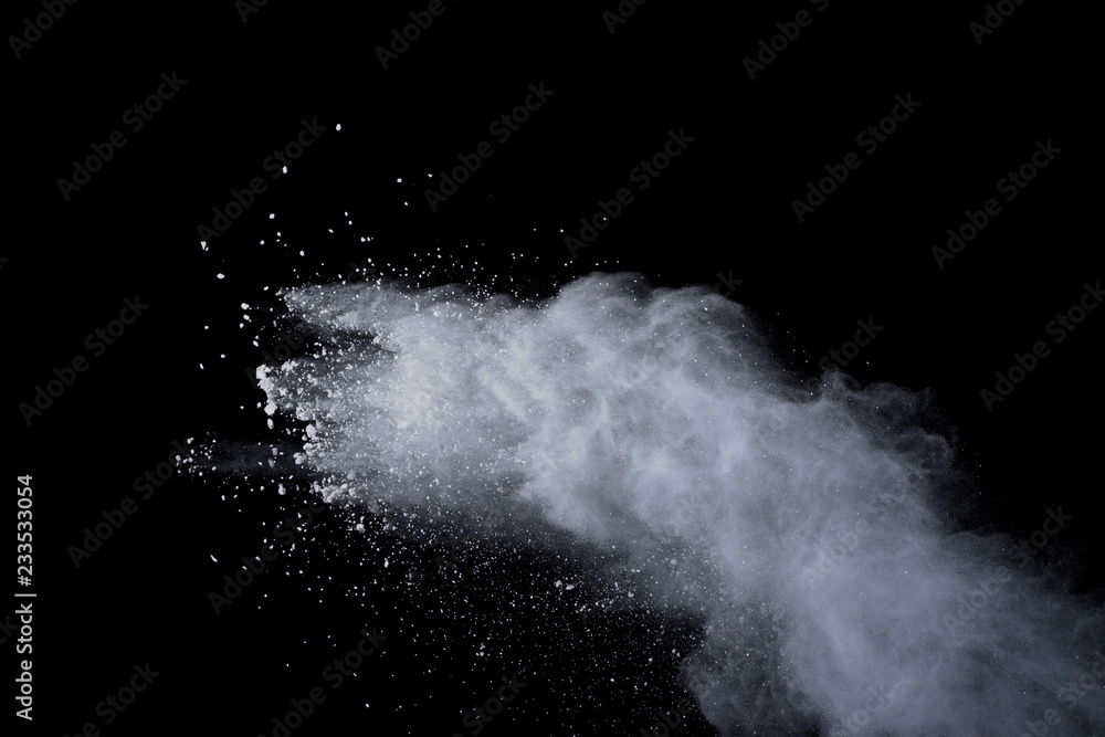 White powder explosion on black background. Dust splatted isolated. Paint Holi. White powder explosion on black background. Dust splatted isolated. Paint Holi.