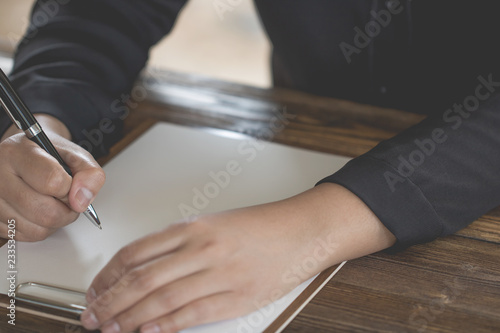 Lady holding pen, it's like a letter writer. Creative idea of work 2019 goals, writing, drawing,making notes in document.Business,investment,concept,Vintage ,Retro natural mood style. soft focus.