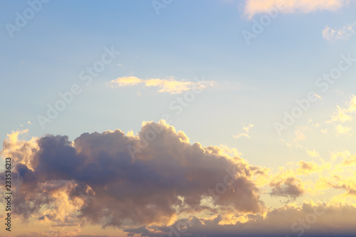 Pink vanilla heaven. Bright blue sky with gentle cumulus clouds. Dawn summer background. © Alwih