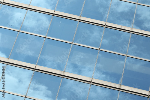 Wallpaper Mural Glas facade with reflection of blue sky and clouds on a business building in Ginza district, Tokyo, Japan Torontodigital.ca