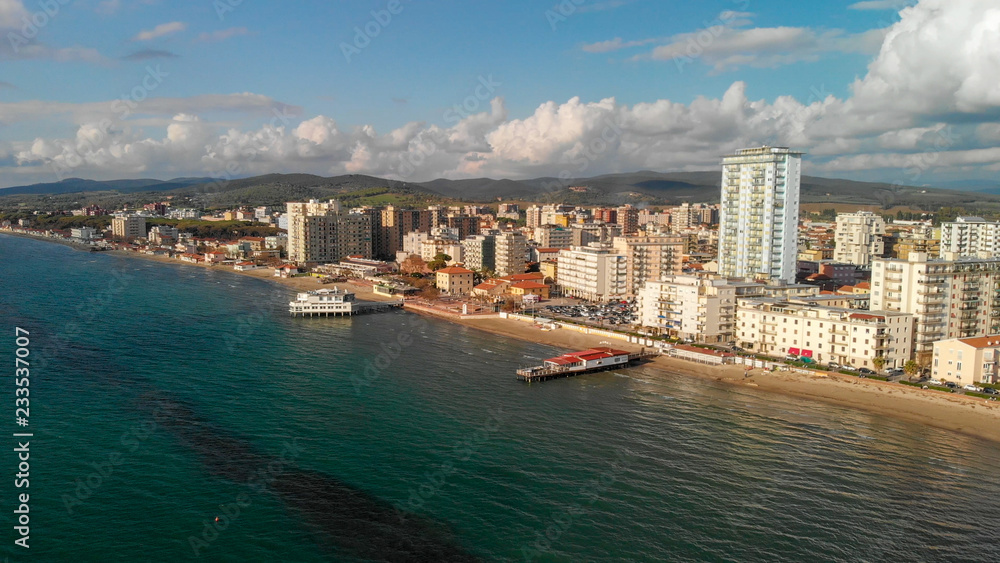Panoramic aerial view of Follonica, Italy. Coastline of Tuscany with town and ocean