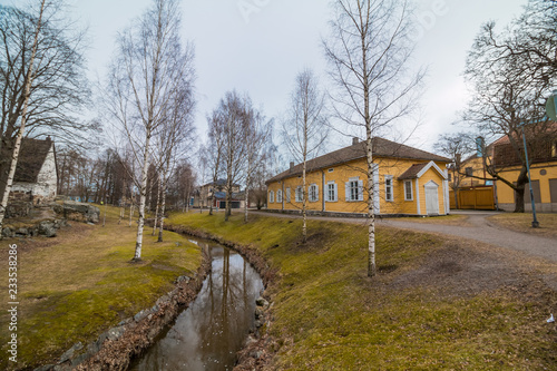 Fototapeta Naklejka Na Ścianę i Meble -  Old wooden houses on the riverside near Helsinki in Finland
