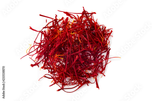Saffron spice threads (strands) isolated on white background