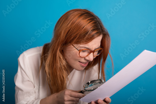 young girl controling paper...