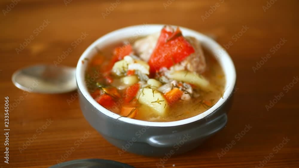 vegetable soup with meatballs and pepper in a plate vegetable soup with meatballs and pepper in a plate